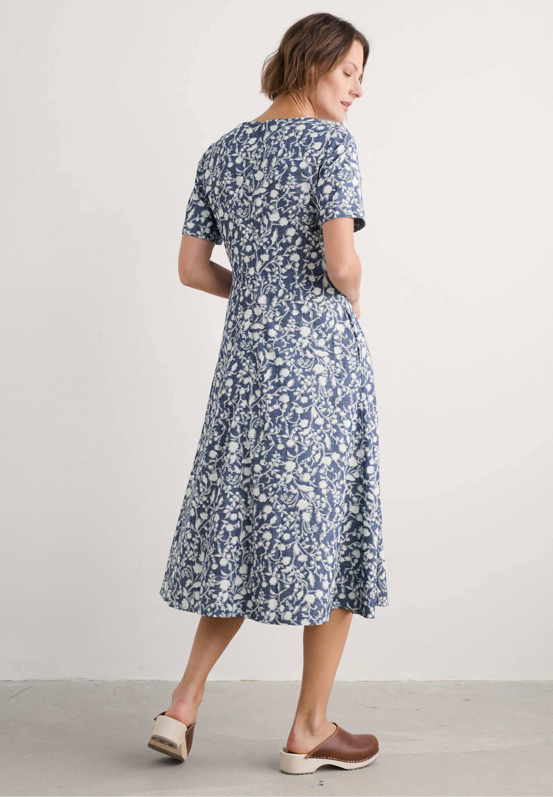Woman wearing the Fox Path midi Dress in Shadow Blossom Indigo by SEASALT