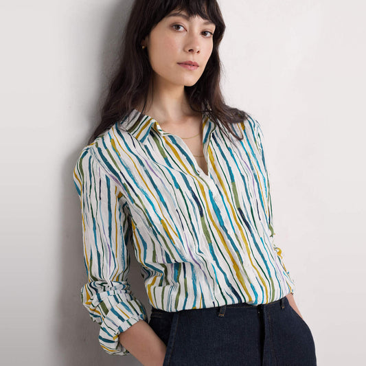 Woman wearing the Larissa cotton Shirt by SEASALT in Painterly Stripe Chalk