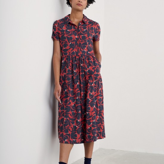 Woman wearing the Mainland Jersey Midi Dress in Floral Cutout Dark Cinnamon by SEASALT