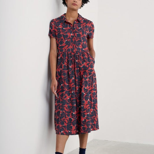 Woman wearing the Mainland Jersey Midi Dress in Floral Cutout Dark Cinnamon by SEASALT