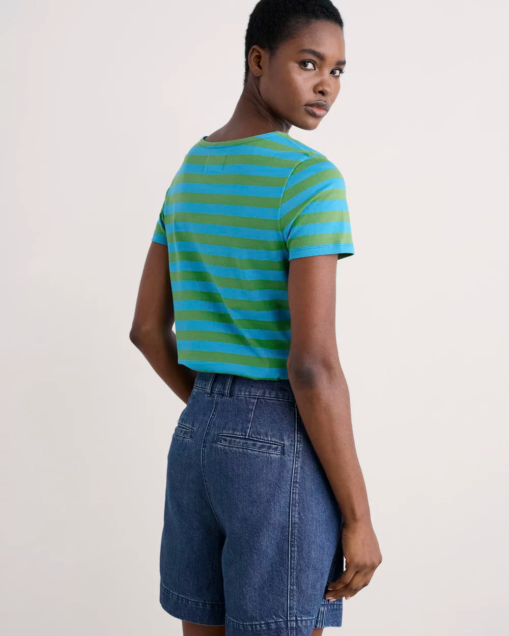 Woman wearing the Sailor striped T-Shirt in Scallion Hedgerow by SEASALT