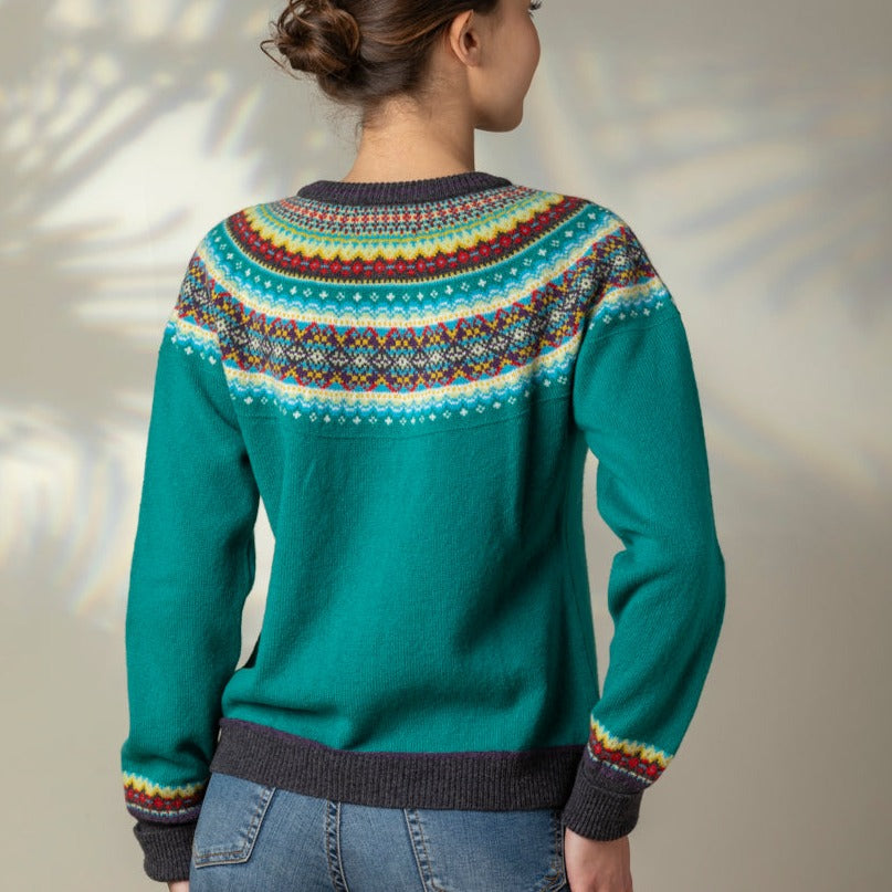 Eribé's Alpine Short women's Cardigan in Tigerlily. Turquoise fairisle cardigan.