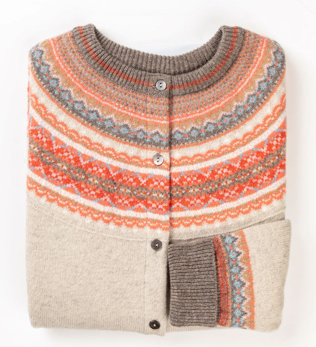A fair isle short cardigan from Eribe in hibiscus.  Sophisticated and elegant, a wonderful mix of colour and pattern, vibrant and long lasting. Made from Merino Wool.