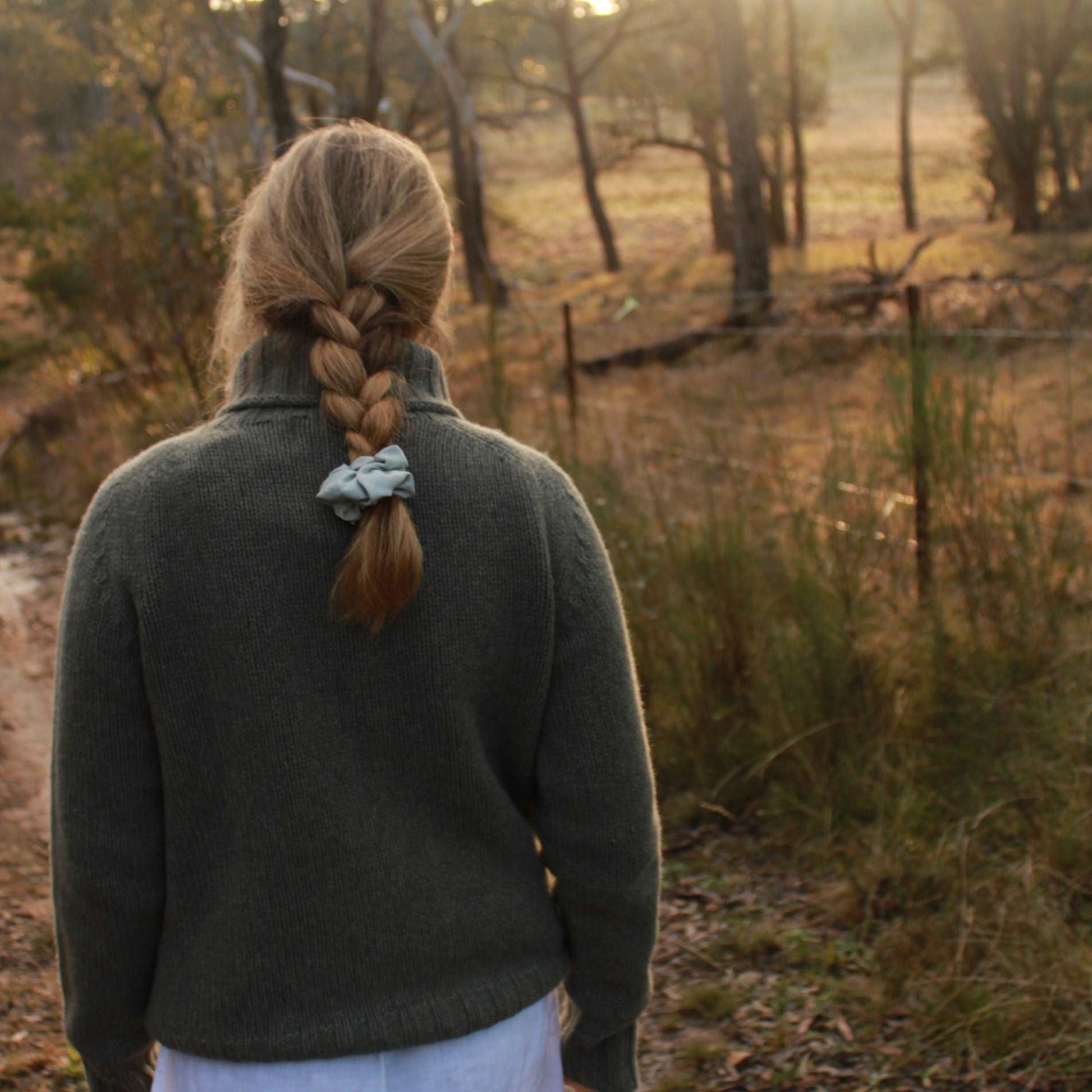 A quality chunky Women's Merino Wool Roll Neck Sweater from Harley of Scotland. In Moss