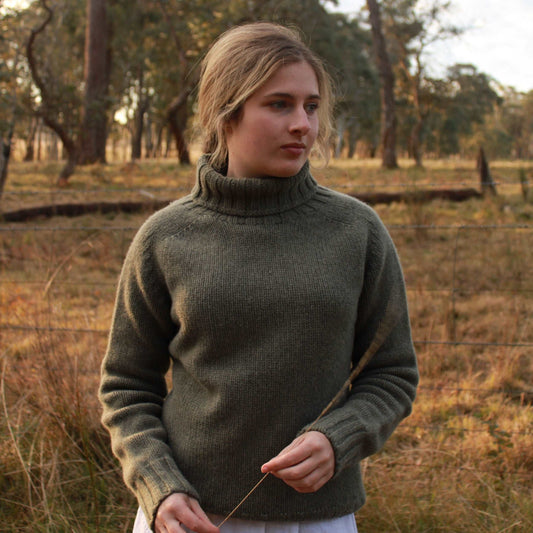 A quality chunky Women's Merino Wool Roll Neck Sweater from Harley of Scotland. In Moss