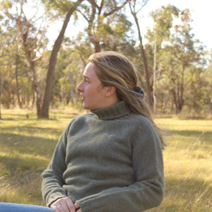 A quality chunky Women's Merino Wool Roll Neck Sweater from Harley of Scotland. In Moss