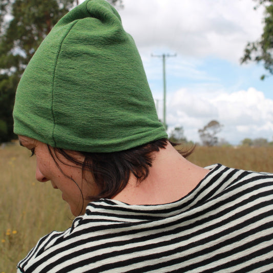 Wool beanie in green. Striped wool top. By Basics.